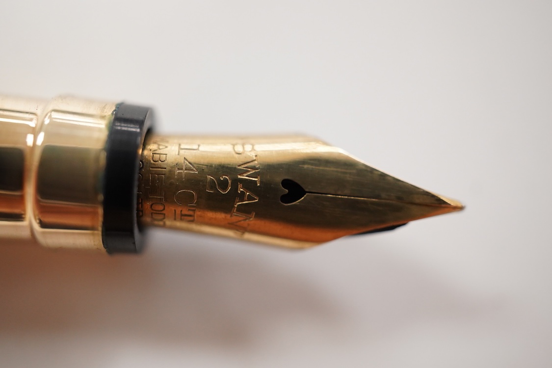A Mabie Todd & Co. Swan gold filled twist filler, Made in England with No.2 14ct. flexible nib